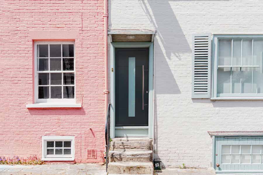 grey aluminium front door with long glass panel in centre